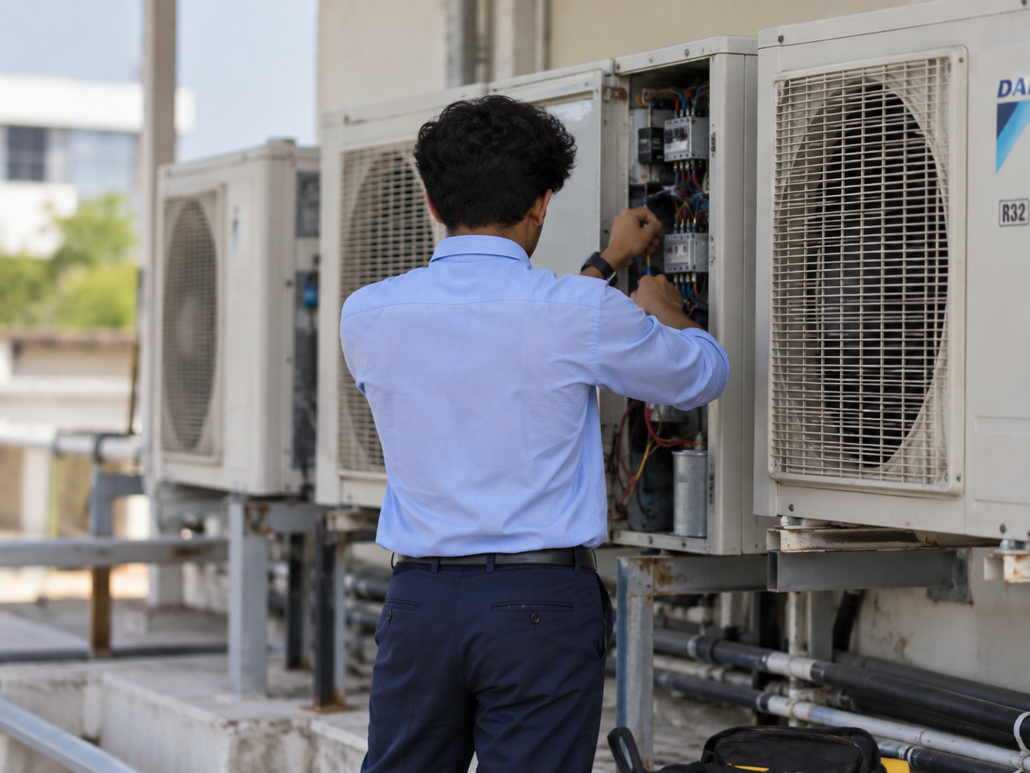 Refrigeration and Air Conditioning technician working on AC unit